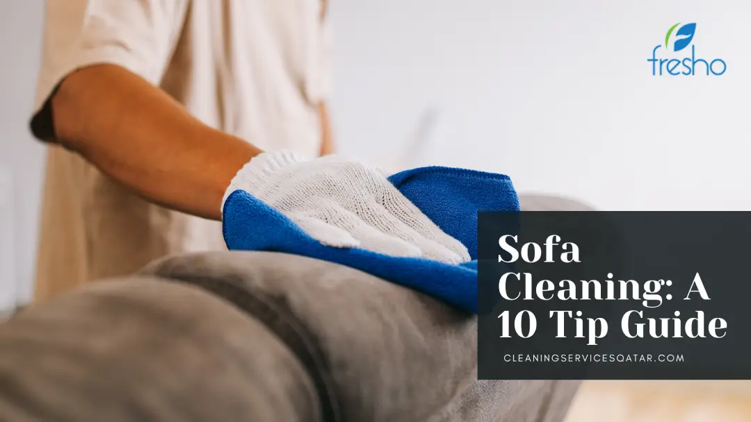 Employee cleaning sofa by best sofa cleaning service in Qatar